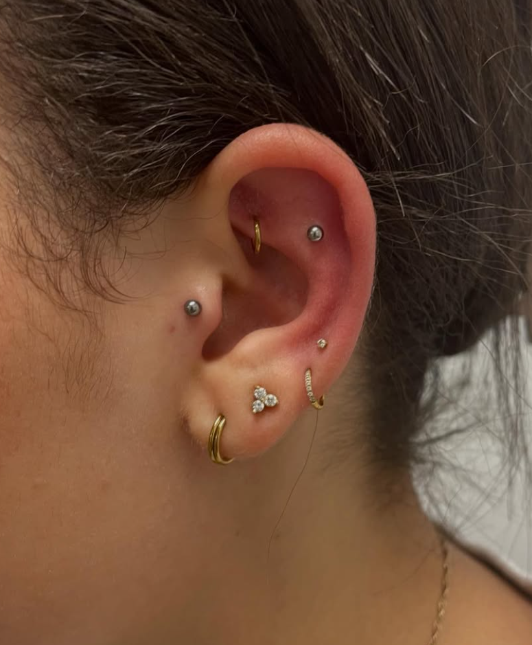 Ear piercing by professional piercer at Two 0 Six Tattoo Ottawa
