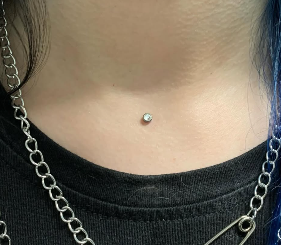 Dermal neck piercing at Two 0 Six Tattoo Ottawa